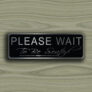 Please wait to be seated sign