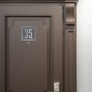 Contemporary Brushed Metal and Black Door Sign AD102-BSB