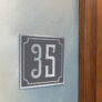 Contemporary Brushed Metal and Black Door Sign AD102-BSB